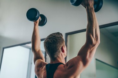 Guy lifting dumbbell